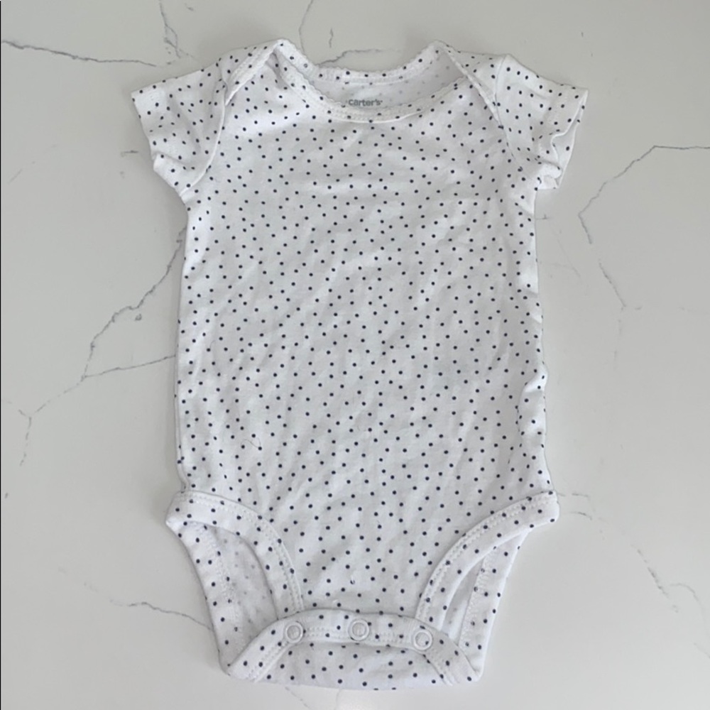 White polkadot baby onesie